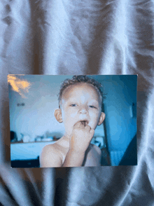 a picture of a baby with a blue background