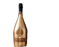 a hand is holding a bottle of champagne with a spade on the label