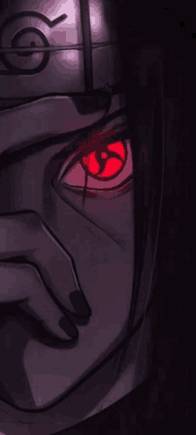 a close up of a person 's face with a red eye and a mask on .