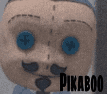 a close up of a stuffed animal with blue eyes and a mustache with the name pikaboo on it .