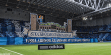 a soccer field with a banner that says stockholms stadion 110 ar