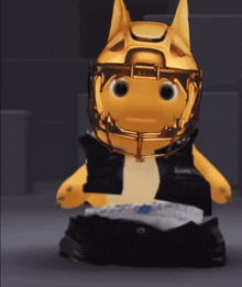 a stuffed animal wearing a helmet and a vest
