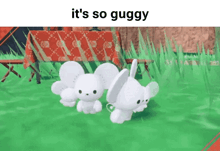 a couple of white rabbits are standing next to each other in the grass .