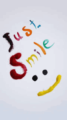 a smiley face with the words just smile written in different colors