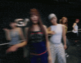 a blurry photo of a woman wearing a top with the number 89 on it