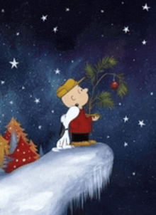 a cartoon of snoopy and charlie brown standing on a snowy cliff with a christmas tree