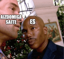 two men are looking at each other and one of them has the word es on his head