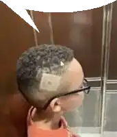 a child with glasses and a bandage on his head is standing in front of a glass .