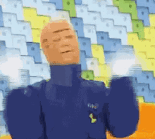 a bald man in a blue jacket is standing in front of a colorful wall