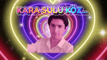 a man stands in front of a heart that says kara sulukoz