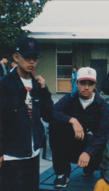 a man wearing a baseball cap with the letter a on it