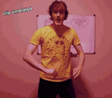 a man in a yellow shirt is dancing in front of a whiteboard that says fundy 's cool ai