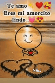 a cartoon character is holding a heart in his hands on a beach and says `` te amo eres mi amorcito lindo '' .