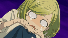 a girl with blonde hair is crying with tears running down her face