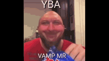 a bald man with a beard is eating a bag of chips with a caption that says yba vamp mr .