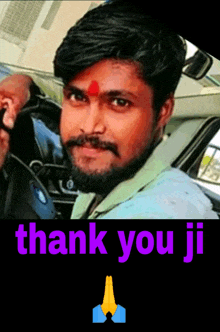 a man sitting in a car with the words thank you ji above him