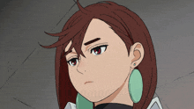 a close up of a girl 's face with a serious look on her face