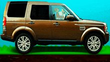 a brown suv with a man sitting in the driver 's seat holding a baby