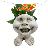 a statue of a face with flowers in it