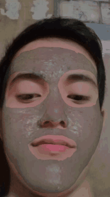 a man with a gray mask on his face