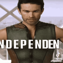 a man is wearing a vest that says dependent on it