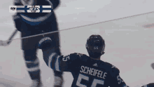 a hockey player with the name scheifele on his back