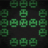 a computer screen displays a pattern of green circles with the letters eee on them