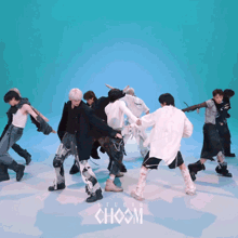 a group of people are dancing in front of a blue background that says choom