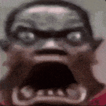 a close up of a person 's face with their mouth open and their eyes glowing .