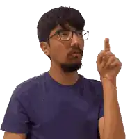 a man wearing glasses and a blue shirt points upwards