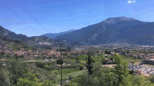 a valley with mountains in the background and a small town in the middle