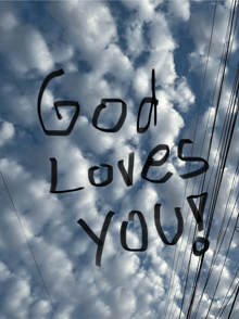 a cloudy sky with the words god loves you written in black