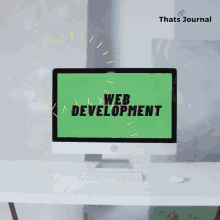 a computer monitor displays the words web development on the screen