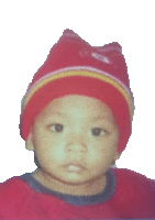 a young child wearing a red hat and a red shirt