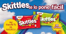an advertisement for skittles in a foreign language with a rainbow in the background