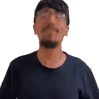 a man with glasses and a beard looks upwards