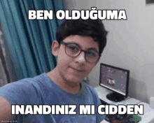 a young boy wearing glasses is taking a selfie in front of a computer monitor with the caption ben olduguma inandiniz mi cidden