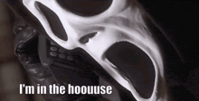 a scream mask with the words i 'm in the hoouuse on it