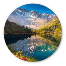 a picture of a lake in the mountains with a mountain in the background