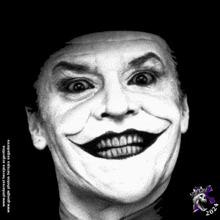 a black and white photo of a man with a joker face