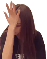 a woman covering her face with her hand while wearing a black shirt that says area