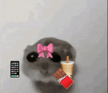 a cat with a pink bow on its head and a drink