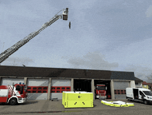 a fire truck is parked in front of a fire station