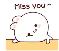 a cartoon seal is laying on the ground and says miss you .