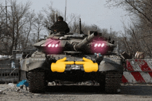 a military tank with a pink light on the front