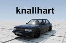 a black car is sitting in front of a sign that says " knallhart "