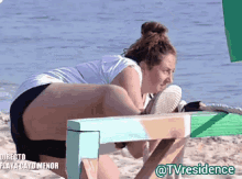 a woman sits on a bench on the beach with the words directo playa cayo menor on the bottom right