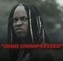 a man with dreadlocks and the words ohio unimpressed in red