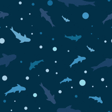 a seamless pattern of sharks and bubbles on a blue background