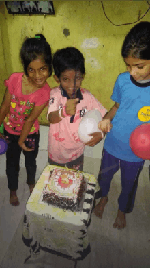 a boy wearing a number 9 shirt is cutting a birthday cake